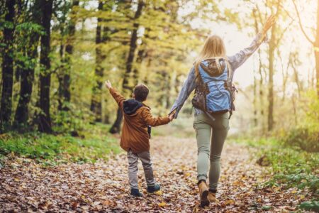 Happy,Mother,And,Son,Are,Hiking,In,Forest.